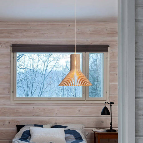 Puncto 4203 pendant light made of wood Ø 45cm in the living room with a wooden wall and window.