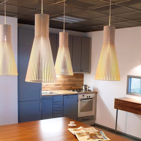 Secto Small 4201 pendant light in wood Ø 25cm in a stylish kitchen setting.