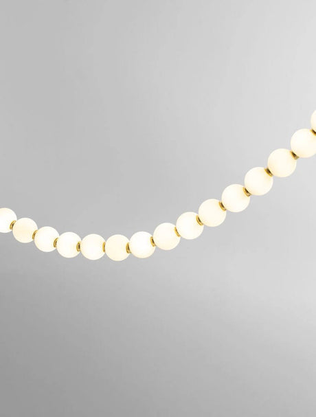 Perla LED ceiling light 70-light 3000K gold, elegant lighting solution for stylish interiors.