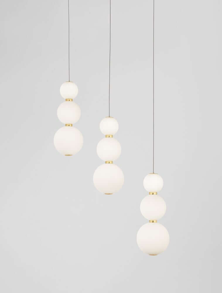 Perla LED Pendelleuchte Balken 70cm 9-flammig 3000K Gold in elegantem Design mit Opalglas und Goldakzenten