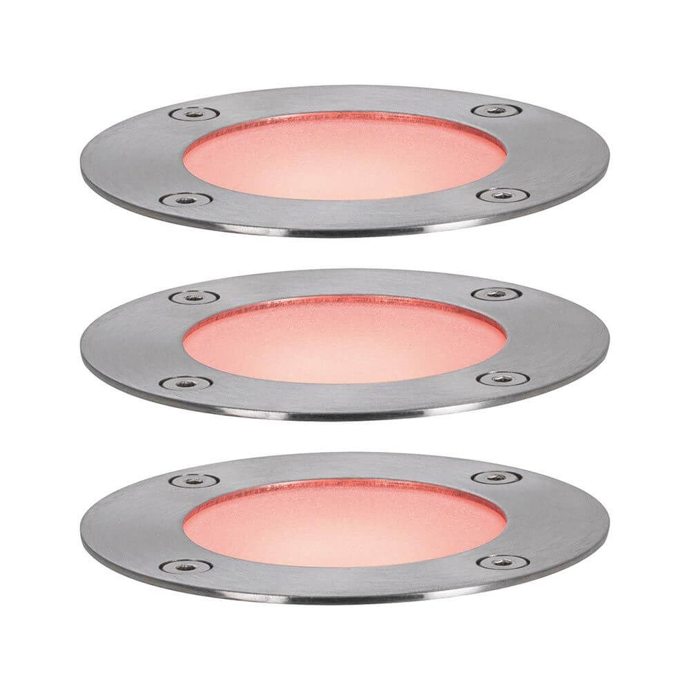 Set aus drei runden Plug & Shine LED Bodeneinbauleuchten mit farbigen LEDs und Edelstahlrahmen.