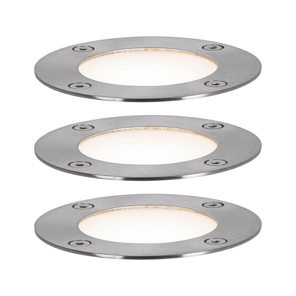 Set mit drei runden Plug & Shine LED Bodeneinbaustrahlern für Gartenbeleuchtung in modernem Design.