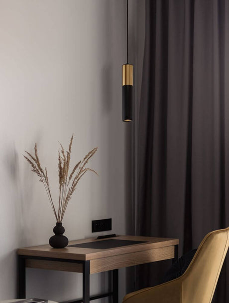 Pongo pendant light cover below Ø 5.6 cm black, gold above a modern table and vase with dried flowers.