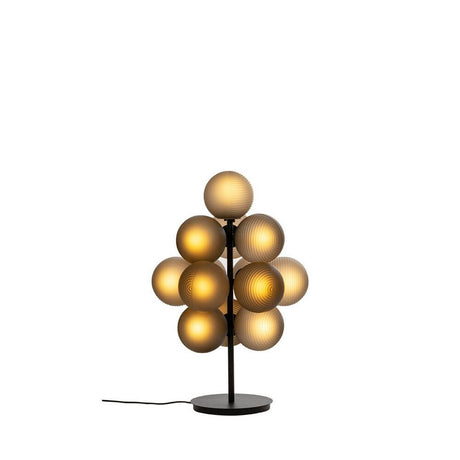 Pulpo LED table lamp Stellar Grape Small 13-light on a black base with frosted glass spheres in gold.