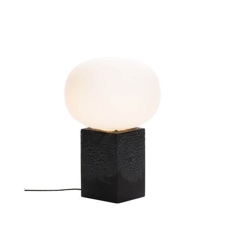 Pulpo LED table lamp Magma One Low Ø 40cm H 60cm on a black ceramic base with a round glass sphere.