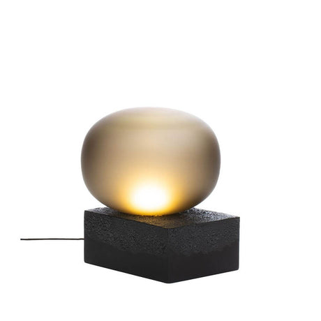 Pulpo LED Magma Two Low table lamp Ø 41 cm H 46 cm on a black ceramic base with soft light.