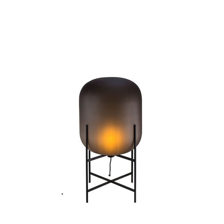 Pulpo LED Oda Medium table lamp Ø 45cm H 85cm with warm light on a black frame.