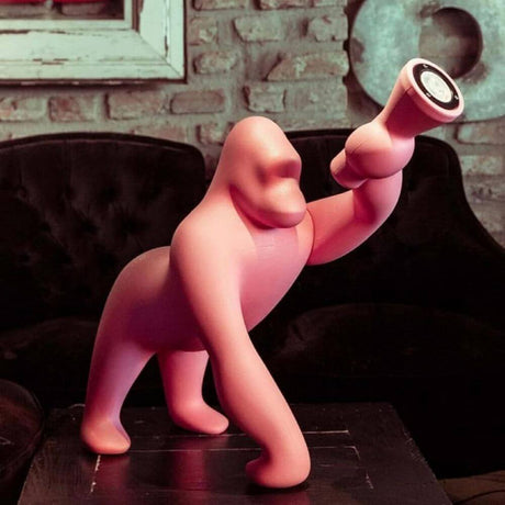 Kong XS table lamp Gorilla in the shape of a stylized pink gorilla holding a lampshade.