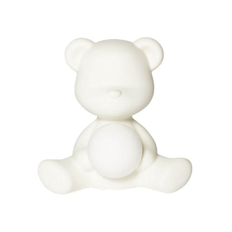 Teddy Girl rechargeable table lamp as a table lamp in the design of a teddy bear with a glowing sphere.