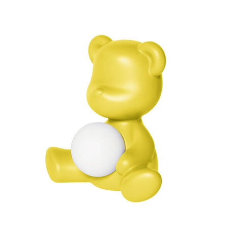 Teddy Girl rechargeable table lamp in yellow with a glowing sphere, designed by Stefano Giovannoni.