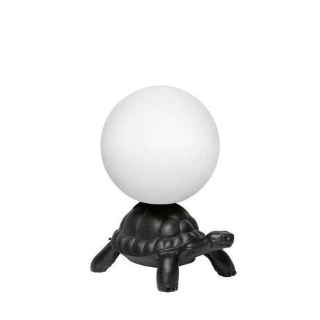 Turtle Carry LED Akku Leuchte IP55 mit leuchtendem Ball auf dem Panzer in schwarzer Ausführung.