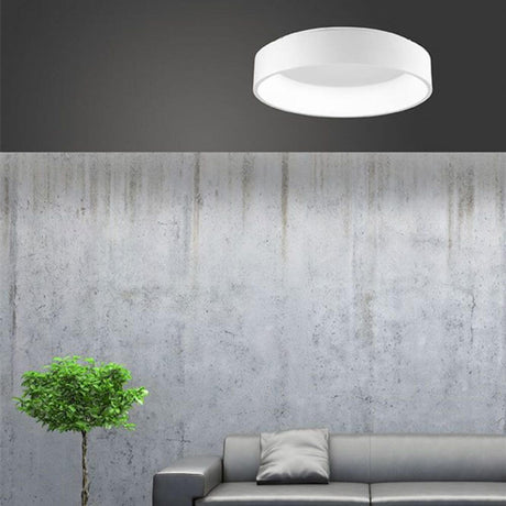 Rando LED Deckenleuchte Ø 60cm 42W, 4000K Weiß in modernem Wohnraum über einem Sofa.