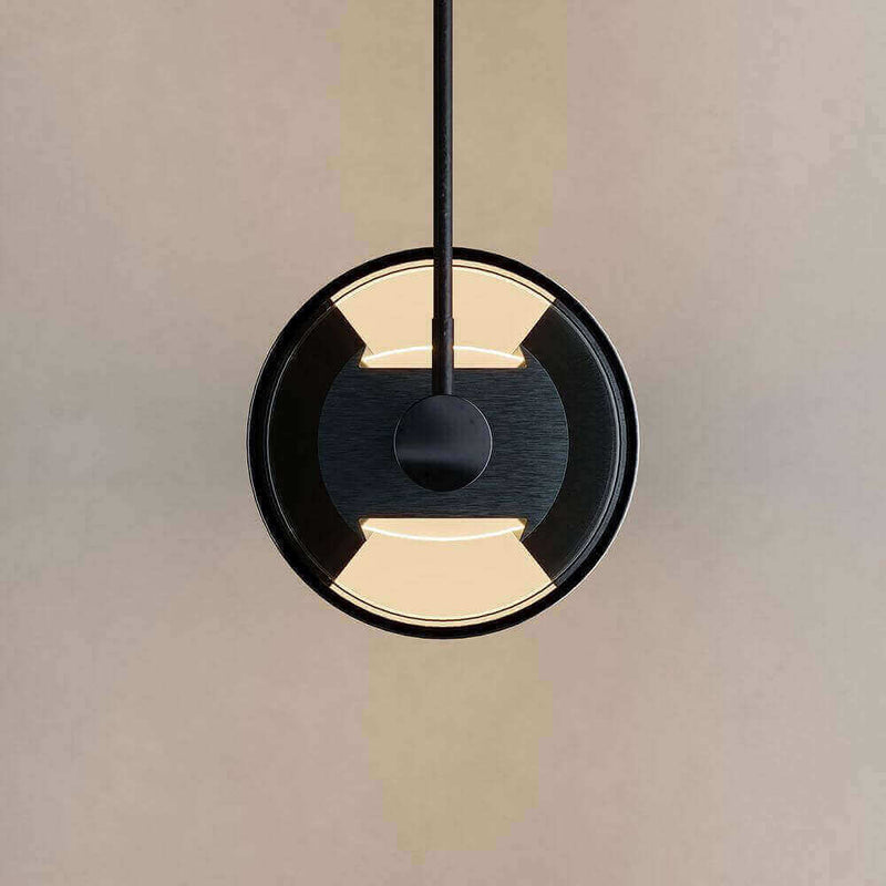 Moderner runder Pendelleuchte mit schwarzem Design und warmem Licht, ideal für stilvolle Innenräume.