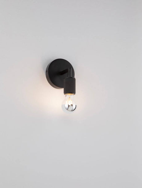 Royal wall light Ø 12cm E27 on a white wall, modern design with beautiful light accentuation.