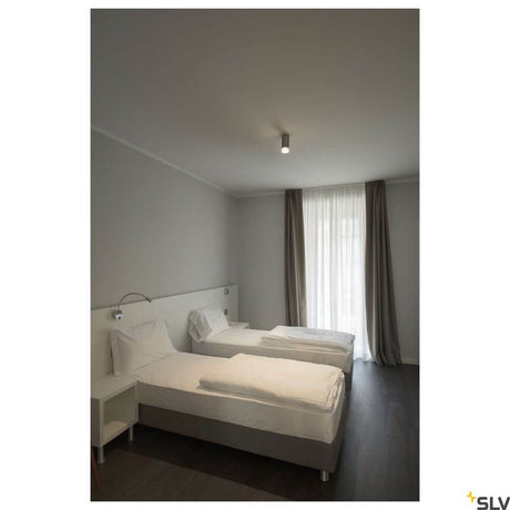 Astina surface-mounted light QPAR51 grey in a modern bedroom with two single beds.
