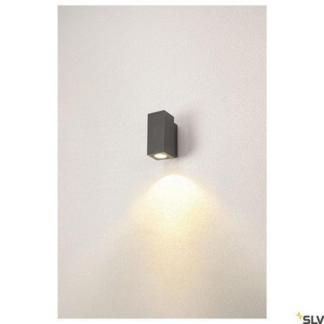 Enola LED wall surface-mounted light Square IP65 anthracite installed on a wall, with warm light glow.