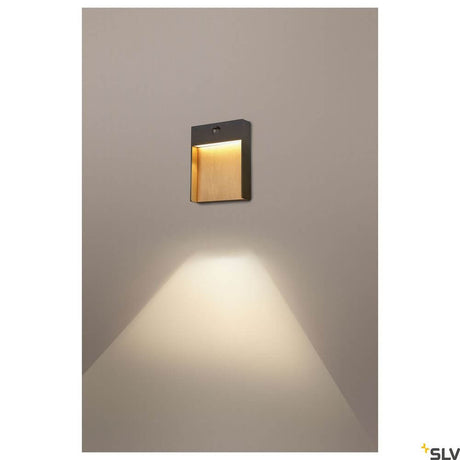 Flatt Sensor LED outdoor wall light 3000K anthracite, brown mounted on a wall with warm light.