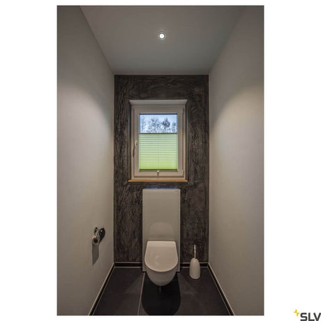 New Tria 68 I Cs recessed light Alu round 2700K in a modern bathroom with toilet and window.