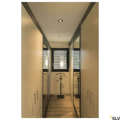 New Tria 68 I Cs Recessed Light Black Round 2700K in modern interior with mirrors.