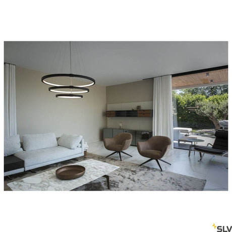 One Triple pendant light Dali 3000/4000K Black in a modern living space with elegant furniture.
