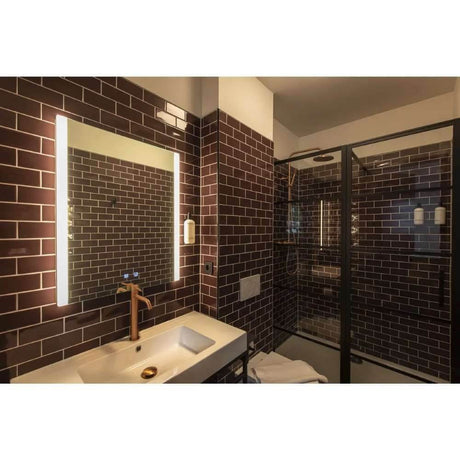 Trukko Square LED mirror wall light, milky, in a modern bathroom with stylish tiles.