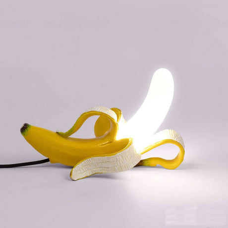 Seletti Banana Huey Tischleuchte: kreative Bananenlampe aus polierter Bronze, die im Bestehenden leuchtet.