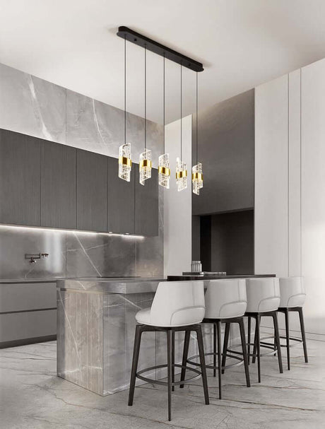 Seneca LED pendant light bar 82cm 5-light 3000K black, gold above a modern dining table in a stylish room.