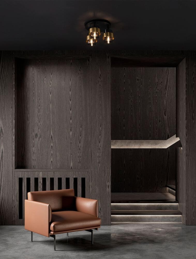 Sianna Deckenleuchte 3-flammig Ø 37cm Gold, Rauch, Schwarz über modernem Wohnzimmer mit Lederfauteuil und dunkler Holzvertäfelung