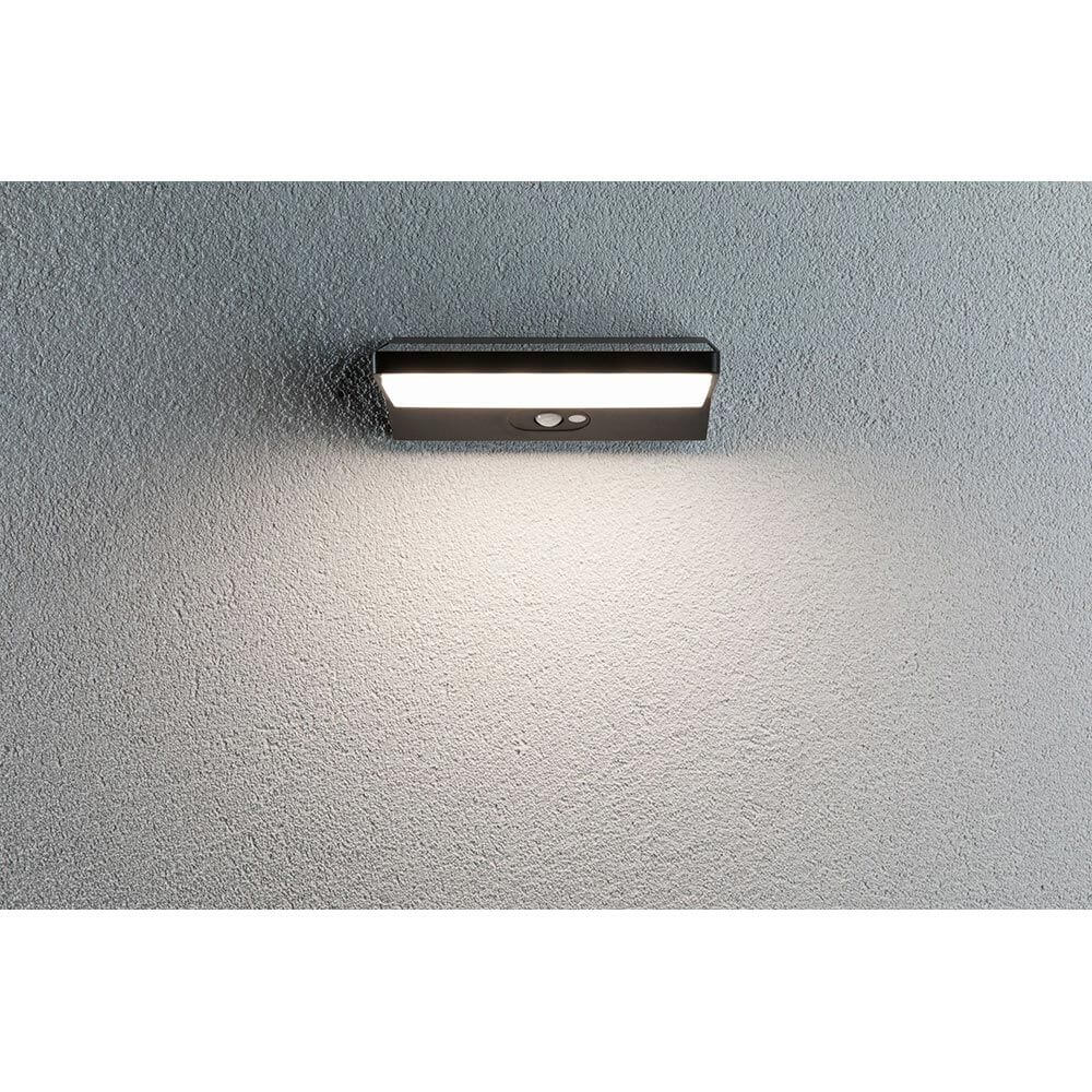 Solar LED Außenwandleuchte Ronas mit Sensor Dunkelgrau an grauer Wand montiert