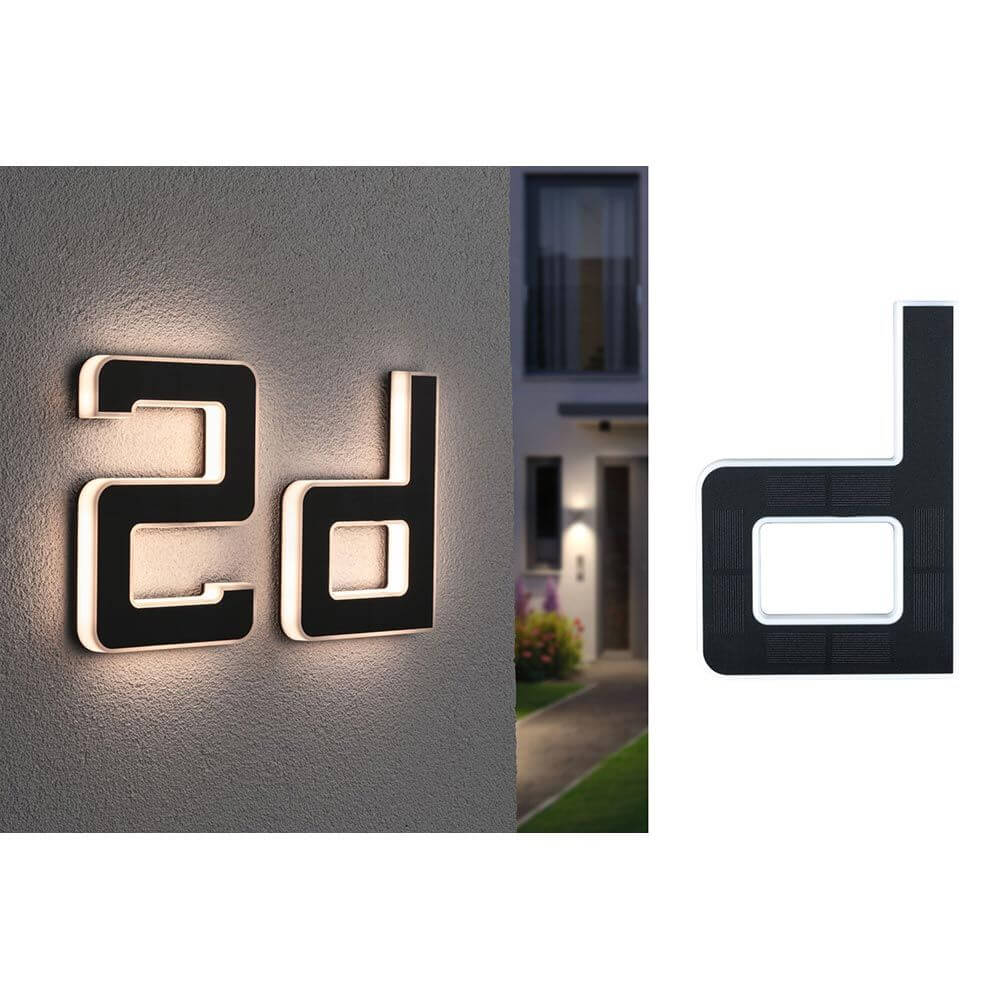 Solar LED Hausnummernleuchte mit Buchstabe D in Schwarz, wandmontiert, warmweißes Licht und IP44 Schutz.