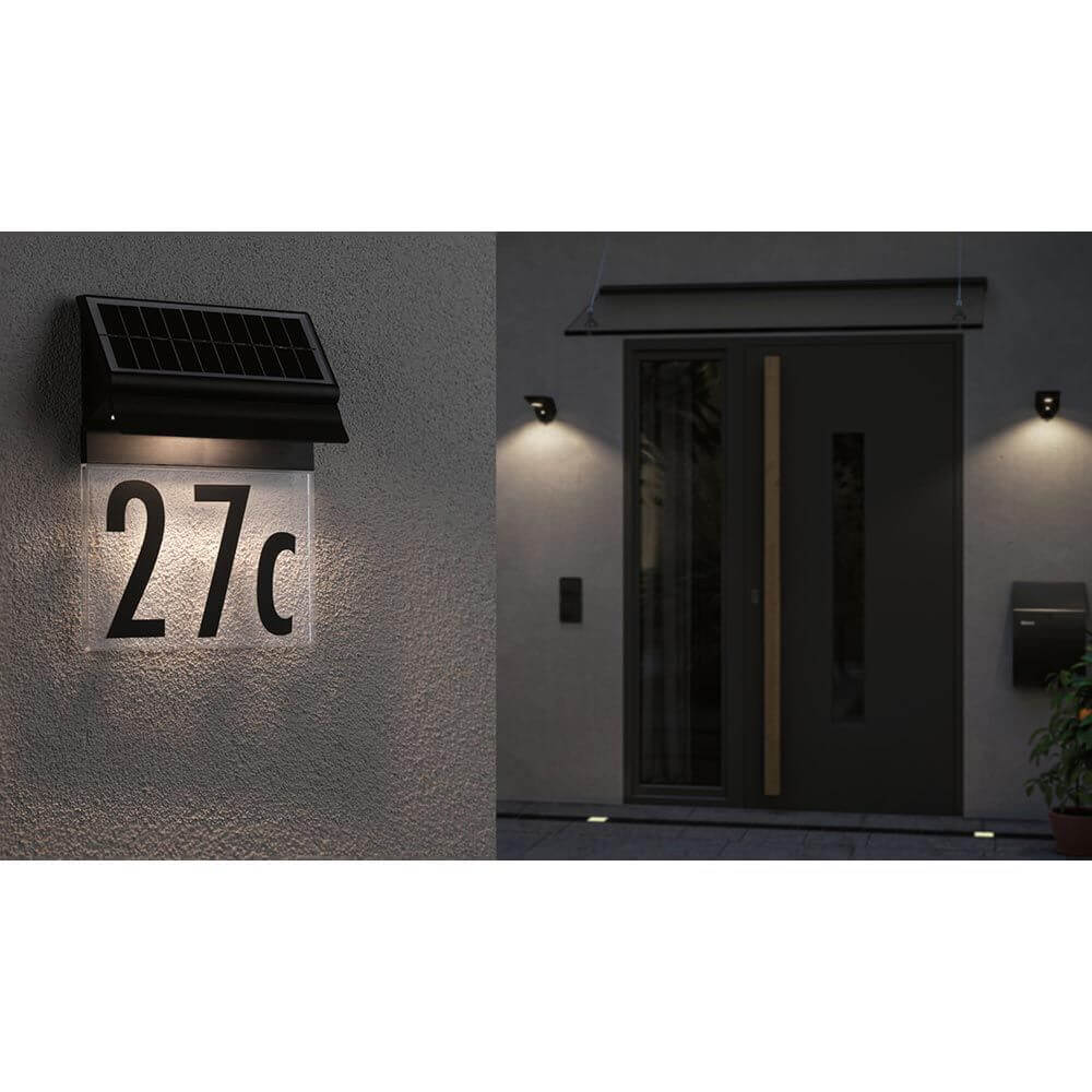 Solar LED Hausnummernleuchte Neda in Schwarz, montiert an einem modernen Eingangsbereich, beleuchtet die Nummer 27c.