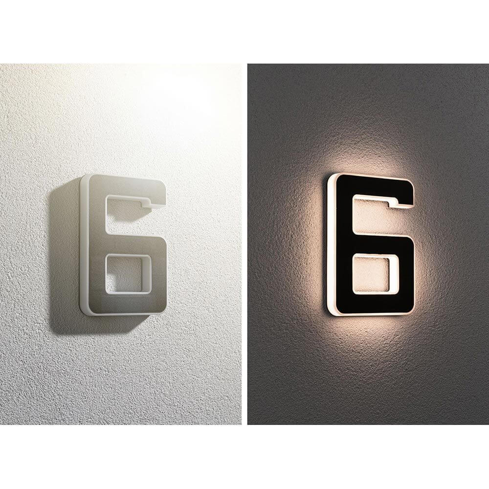 Solar LED Hausnummernleuchte Nummer 6 mit warmweißem Licht und dekorativem Design an der Wand.
