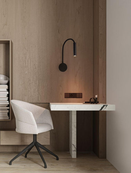 Sonica LED wall light Ø 8.5 cm 3000K IP44 on a modern desk in a stylish interior.