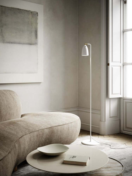 Nexus 2 floor lamp in a modern living room with a beige sofa and minimalist decorations.