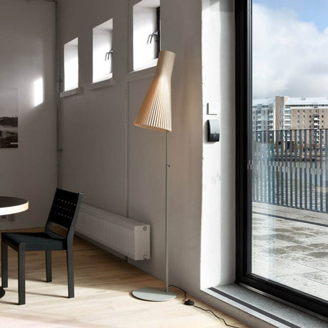 Secto 4210 floor lamp made of wood in a modern setting, adjustable from 175 to 185 cm.