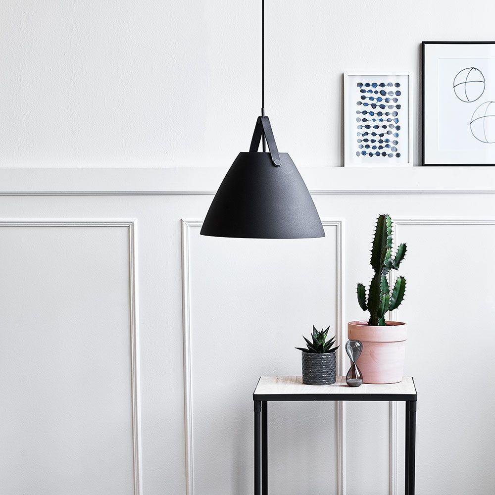 Strap 36 pendant lamp Ø 36cm with 2 leather straps black in a modern room with plants.