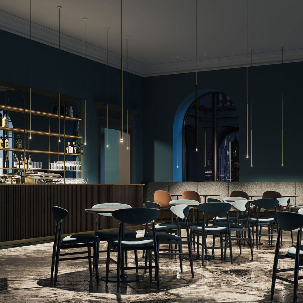 Moderne Innenansicht einer Bar mit Lodes A-Tube Nano LED Hängelampe, eleganter Einrichtung und gemütlicher Atmosphäre.