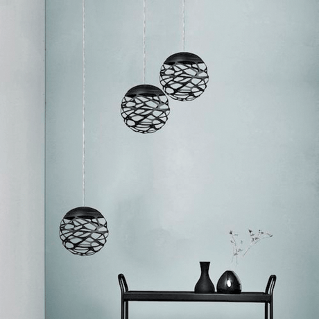 Lodes Kelly Cluster Sphere LED black pendant lamp, three pendant lights mounted on a wall.