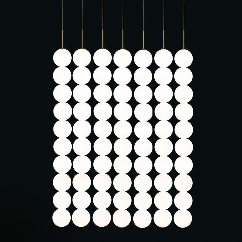 Terzani Abacus LED Design-Hängeleuchte 5er mit modularen, kreisförmigen Lampen in eleganter Anordnung.