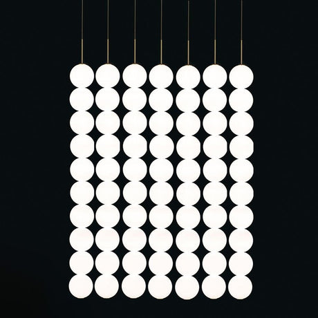 Terzani Abacus LED-designpendellampe 5-delt med modulære, sirkelformede lamper i elegant oppstilling.