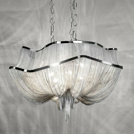 Lustre design Terzani Atlantis XXL Ø 110 cm avec une lumière scintillante et des chaînes nickel drapées.