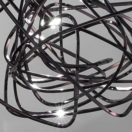 Close-up of the Terzani Doodle table lamp with a unique, handcrafted design and dynamic lines.