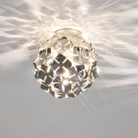 Plafonnier design Terzani Orten'zia Ø 20 cm en finition argentée avec un design en forme de fleur et une lumière scintillante.