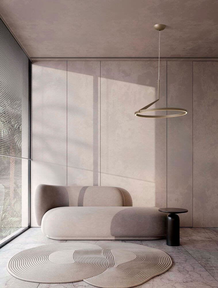 Moderne Wohnlandschaft mit Tilia LED Pendelleuchte über einer eleganten Couch in stilvollem Raum.