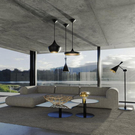 Tom Dixon Beat Tall LED Hängelampe Ø 19cm in modernem Wohnzimmer mit eleganter Einrichtung.