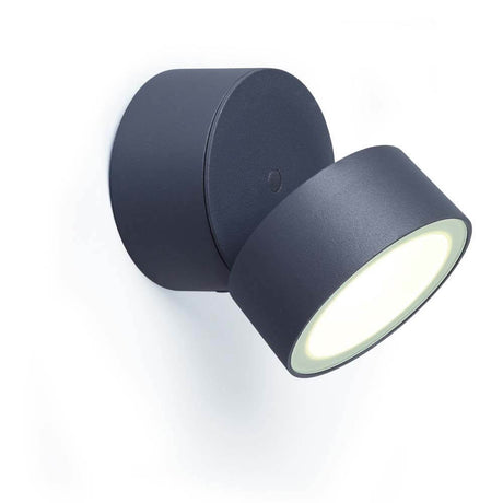Applique murale d'extérieur LED Trumpet L orientable à 90° IP54 anthracite montée sur un mur avec lumière orientable.
