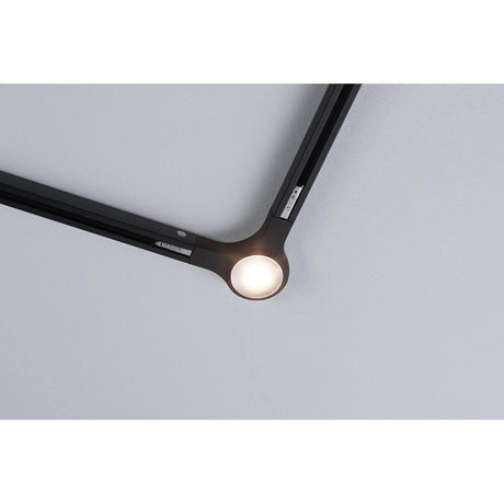 U-Rail connector L-piece Black in use on a ceiling, illuminated and combined with URail tracks.