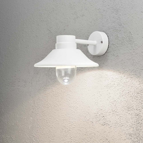 Vega LED outdoor wall light white, clear glass mounted on a grey wall.