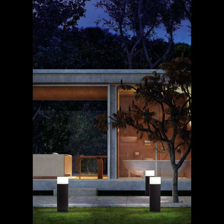 DATNA 60cm path light IP44 Dark grey illuminates the garden in front of a modern house at night.