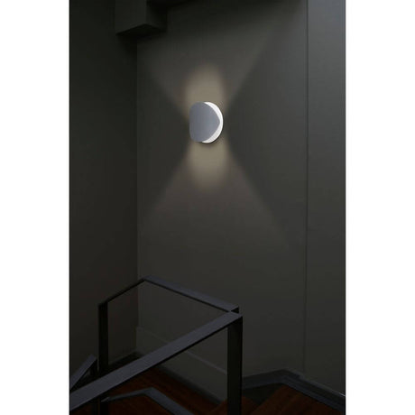 OVO-G white wall light on the wall, elegant lighting for stairwells or hallways.